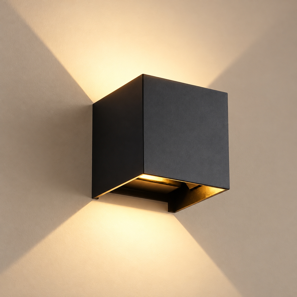 Black cube wall light on a plain taupe wall