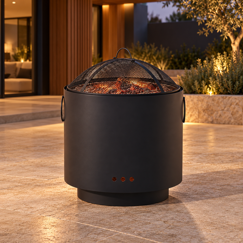 Black cylindrical fire pit with mesh cover on a stone patio